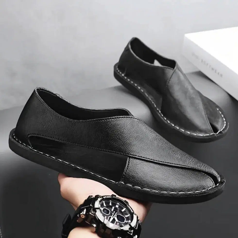 Black Peshawari men's sandals from AeroWalk by 34608, featuring traditional design and leather straps.