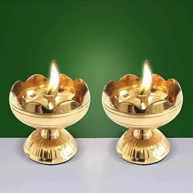 Set of two gold brass table diya lamps from 836, traditional Indian lighting for festive and decorative use.