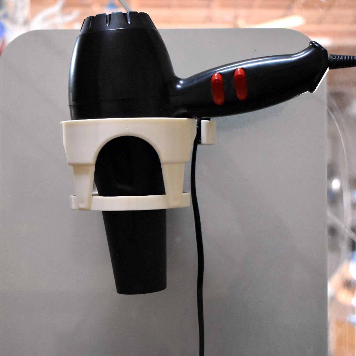 Wukusy 6131 Hair D Holder with suction, used in homes and offices, designed for women and girls to hold hair securely.