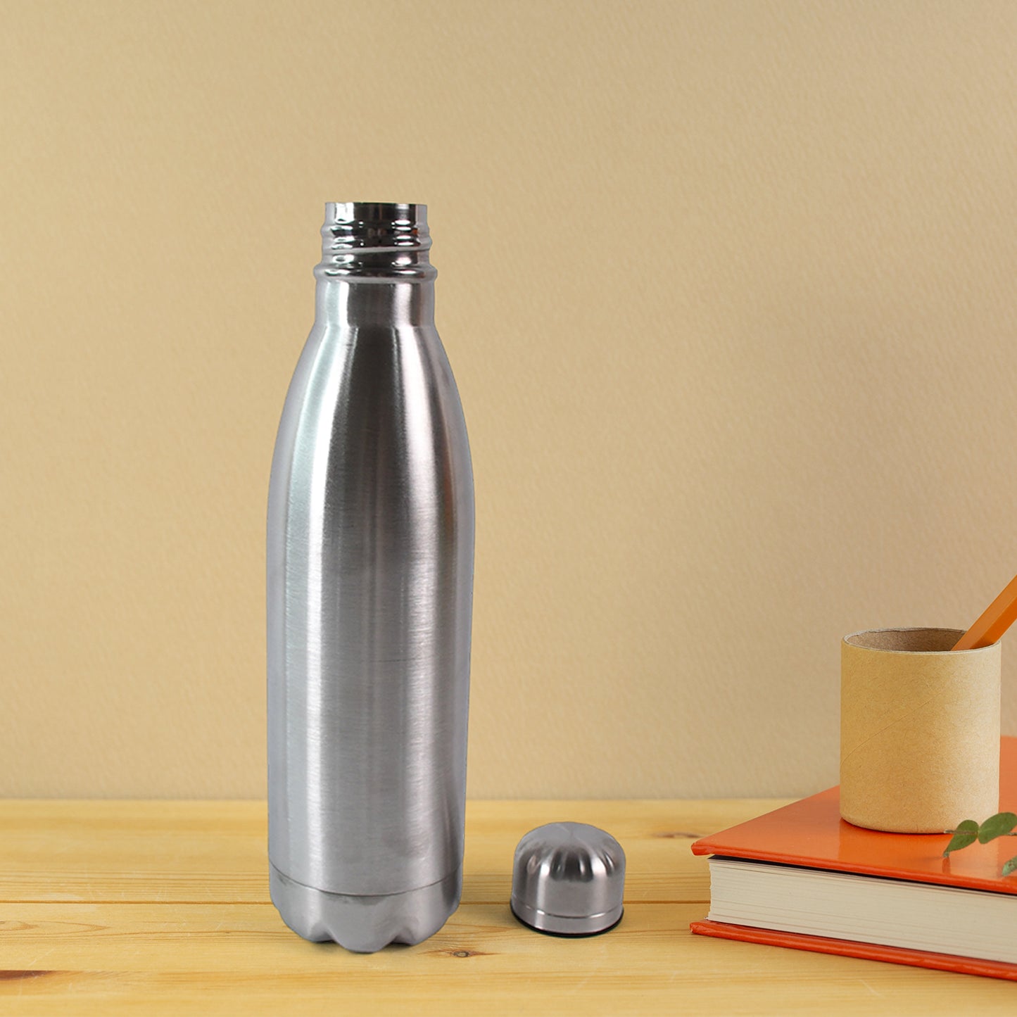 Silver stainless steel water bottle, 500ml capacity, Wukusy brand, with a sleek cylindrical design and screw-top lid.