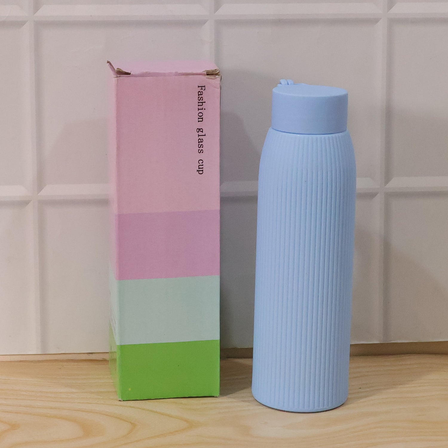 Wukusy premium textured glass water bottle, 300ml, featuring a sleek design and durable glass construction.