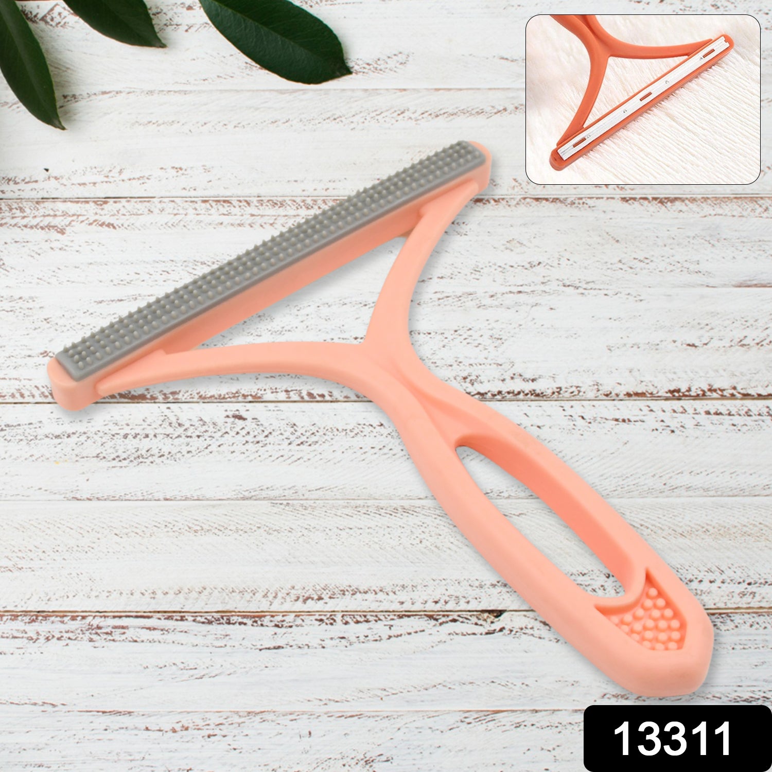 Wukusy portable hair and lint remover, handheld device with cleaning brush for clothing and fabric care.