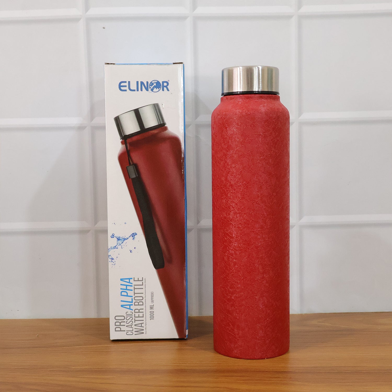 Red Alpha Pro Classic stainless steel water bottle by Wukusy, 1000ml capacity, with a sleek red finish and durable design.