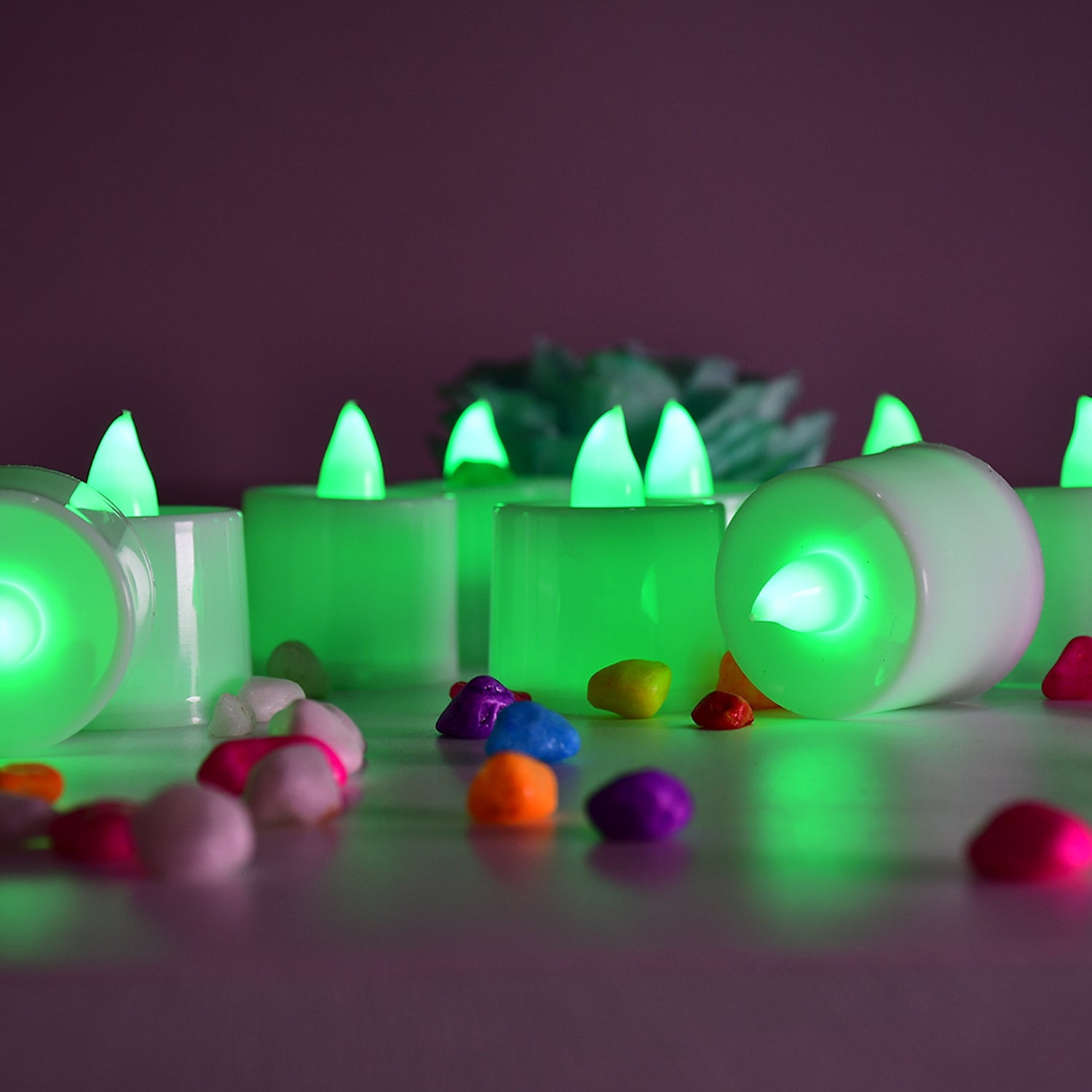 Set of 24 green flameless LED tealights by Wukusy, smokeless plastic candles for home decoration, safe and decorative lighting.