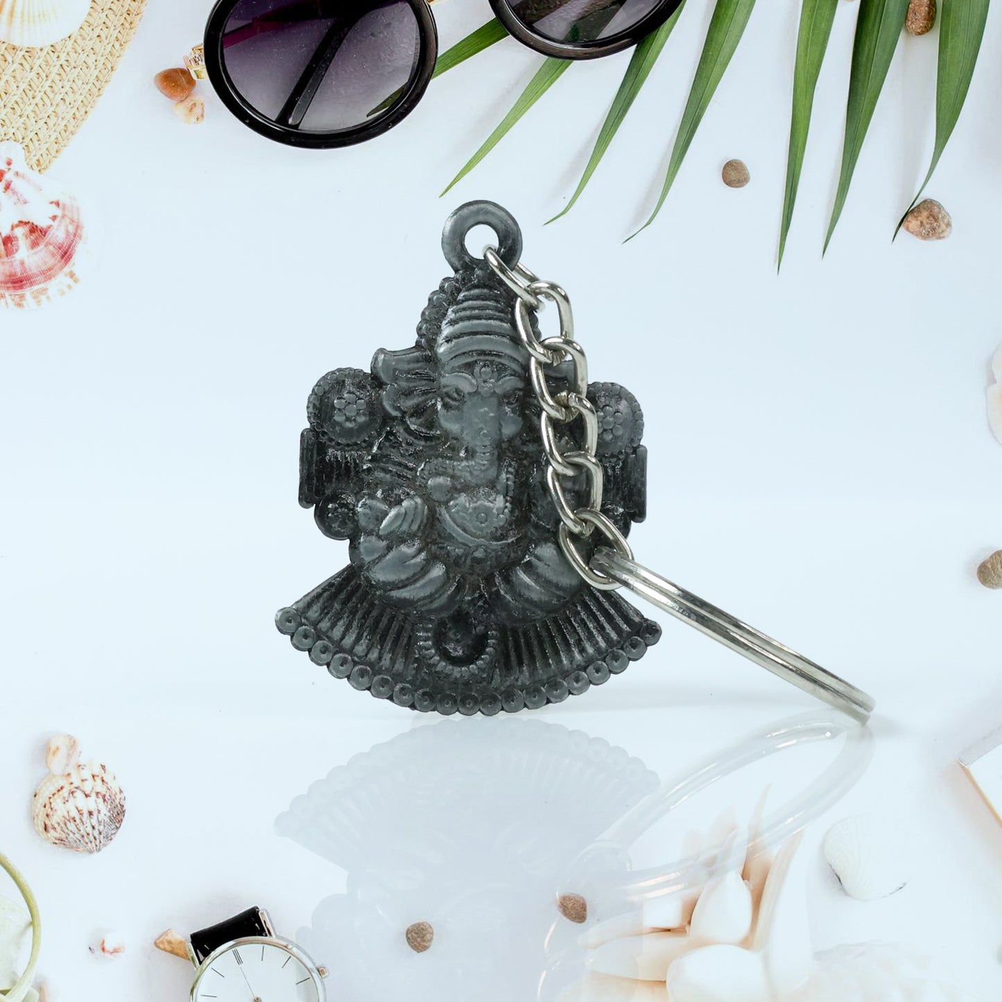 Silver Lord Ganesha sitting design keychain by Wukusy, featuring detailed Ganesha figure on a keychain for spiritual decor.