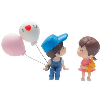 Cute plastic couple car dashboard figurine set by Wukusy, featuring two adorable decorative figurines for vehicle interior display