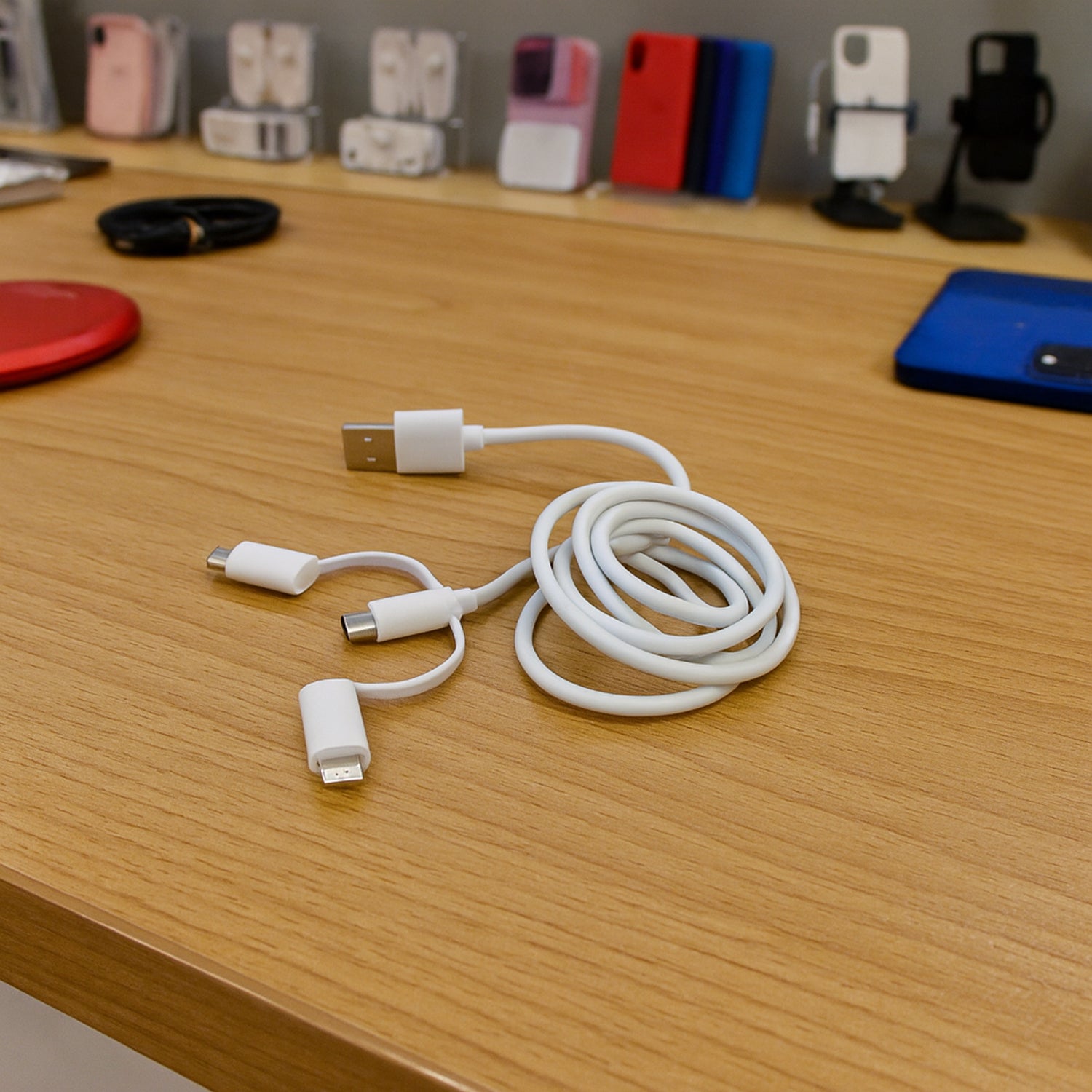 Wukusy 3-in-1 multi charging cable with USB-C, Lightning, and Micro USB connectors for mobile device charging and data transfer.