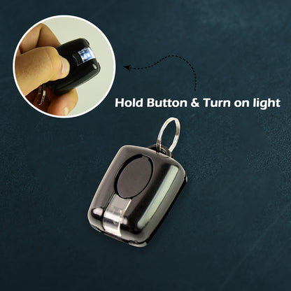 Wukusy mini LED torch keychain showing a compact black keychain with a small LED flashlight attached.