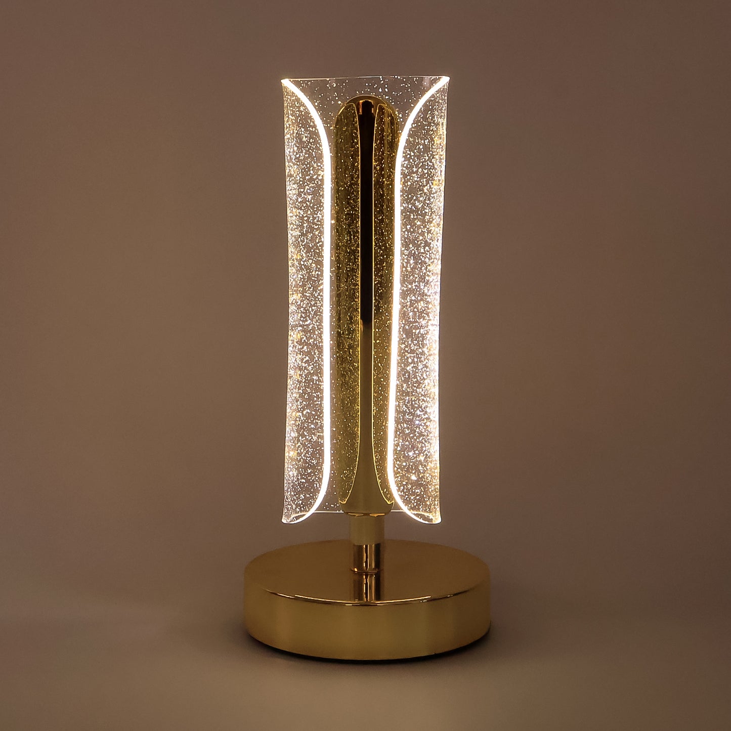 Luxury Wukusy tall cylindrical crystal table lamp with clear glass and modern design, resting on a sleek base.