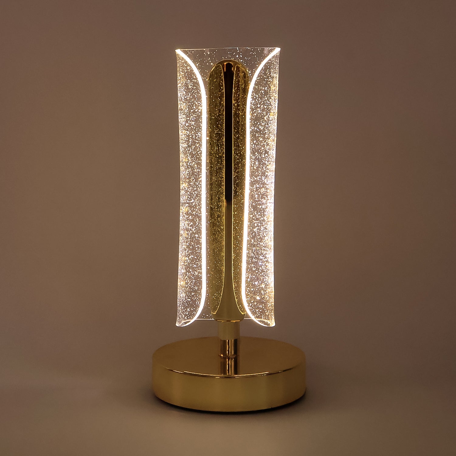 Luxury Wukusy tall cylindrical crystal table lamp with clear glass and modern design, resting on a sleek base.