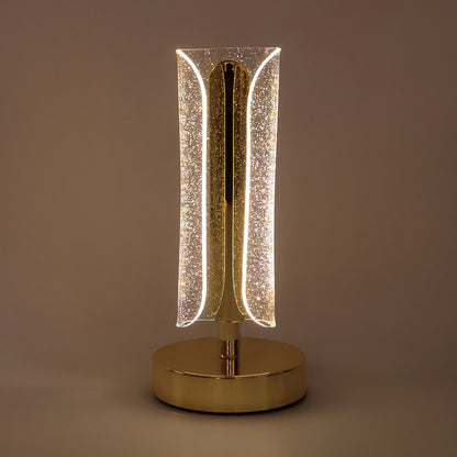 Luxury Wukusy tall cylindrical crystal table lamp with clear glass and modern design, resting on a sleek base.