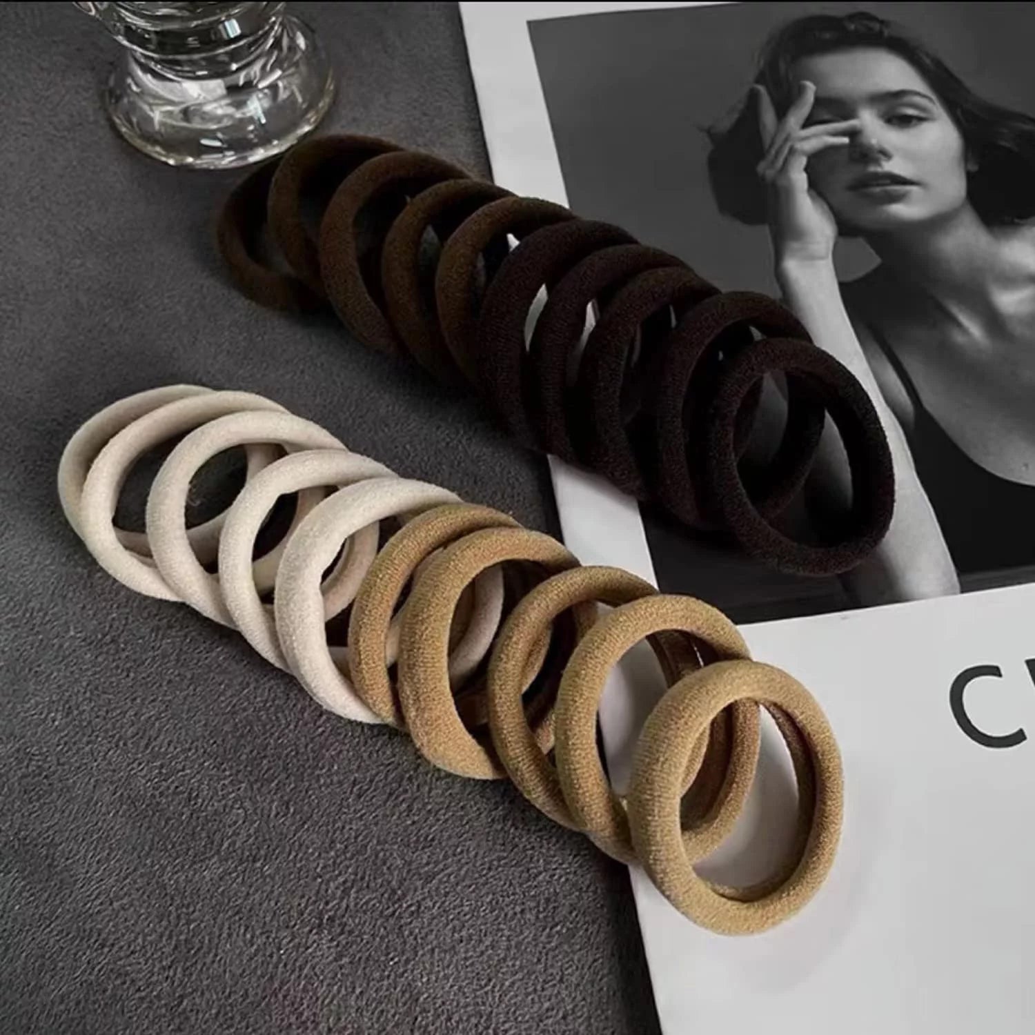Set of 20 soft elastic hair bands by Wukusy, showing multiple black and neutral-colored hair ties on a white background