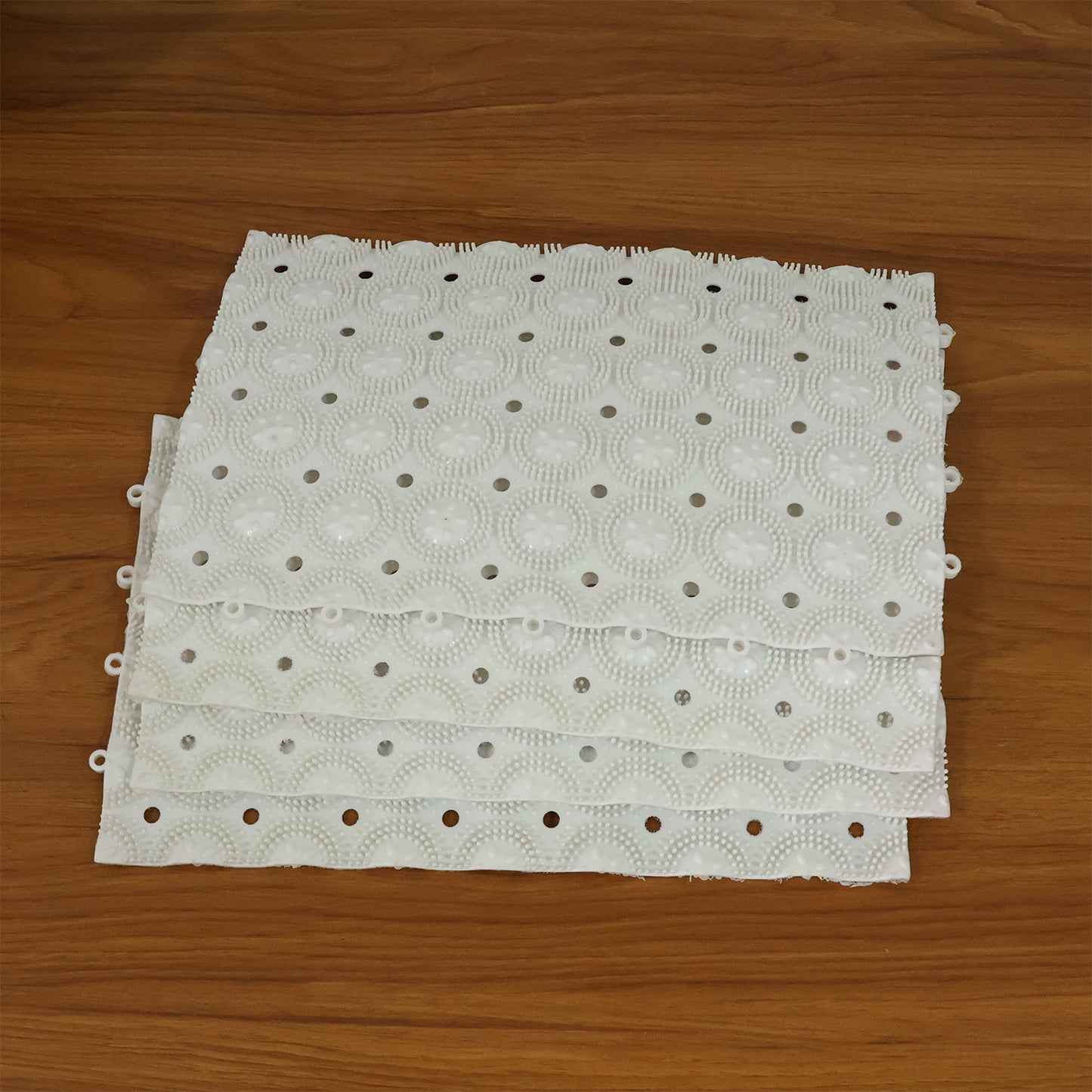 Wukusy anti-slip bathroom massage mats with suction cups, 33x21 cm, set of 4, featuring textured surface for safety and comfort.