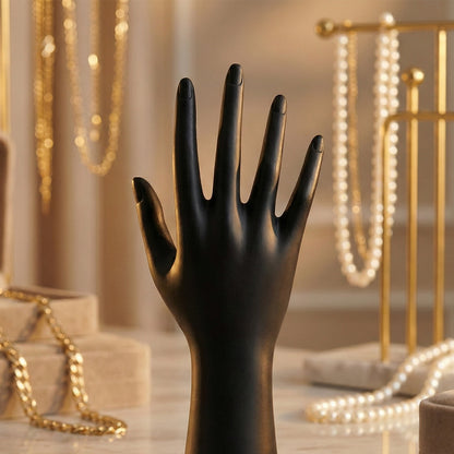 Black hand-shaped jewelry display stand by Wukusy, showcasing rings and bracelets on a sleek, elegant jewelry display stand.