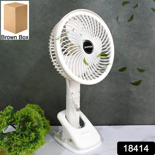 Wukusy multifunctional USB desk fan clipped onto a surface, compact home improvement cooling device with brown box packaging.