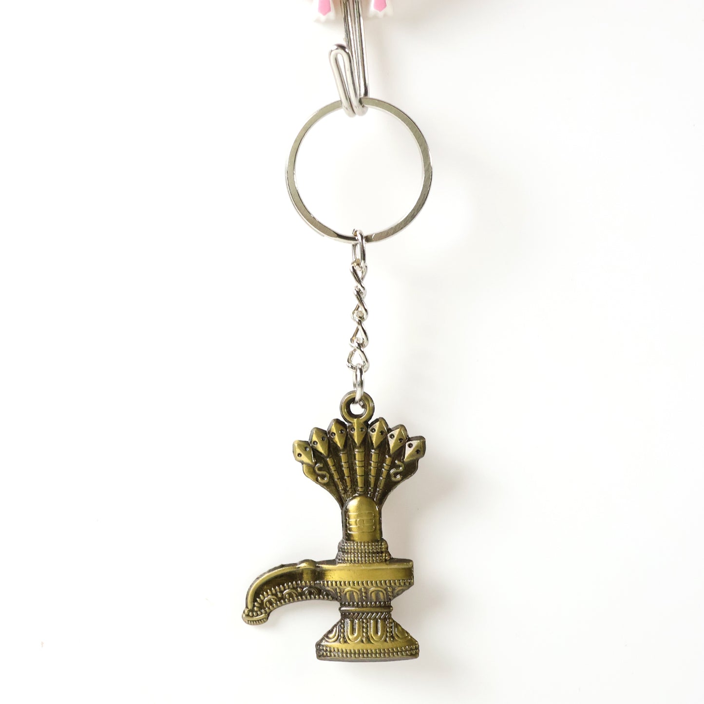 Antique Lord Shiva Shivaling metal keychain from Wukusy, featuring detailed Shivaling design on a small metal key accessory.