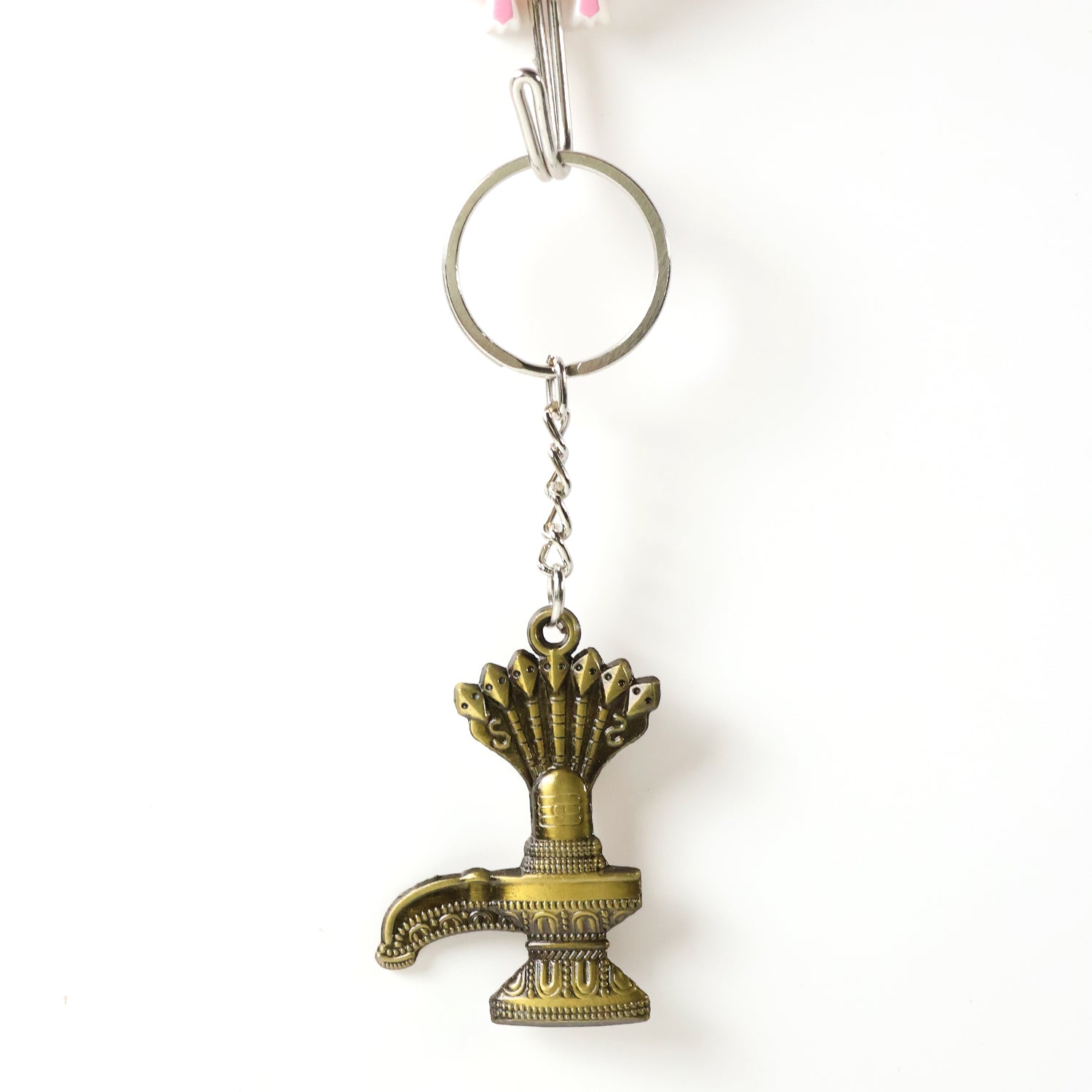 Antique Lord Shiva Shivaling metal keychain from Wukusy, featuring detailed Shivaling design on a small metal key accessory.