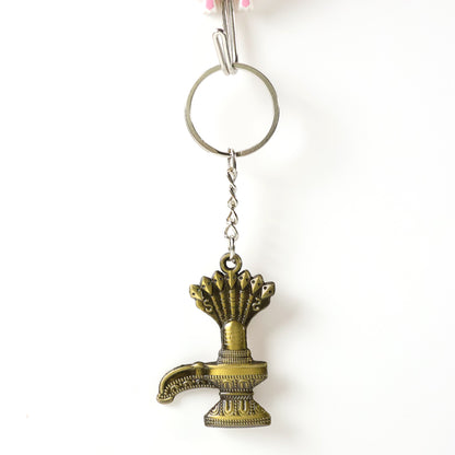 Antique Lord Shiva Shivaling metal keychain from Wukusy, featuring detailed Shivaling design on a small metal key accessory.