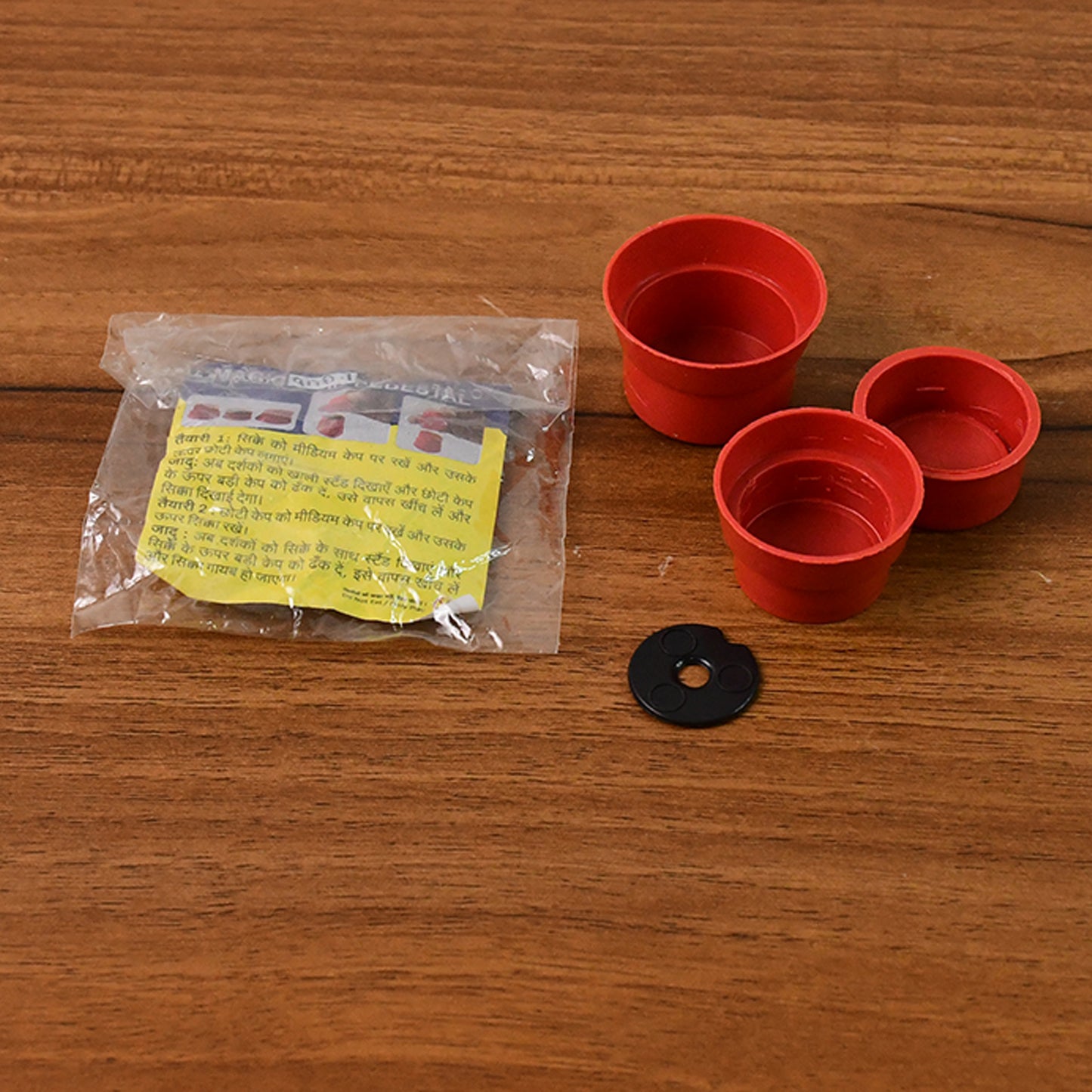 Wukusy Magic Coin Pedestal toy set for kids, featuring an illusion trick with a floating coin and colorful toy display.
