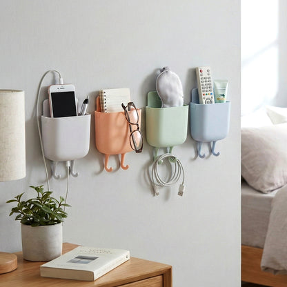 Wukusy multi-purpose plastic wall-mounted mobile charging holder set with four beige organizers on a wall.