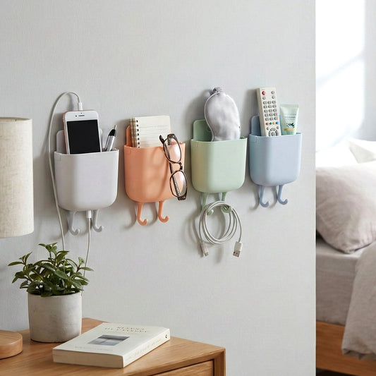 Wukusy multi-purpose plastic wall-mounted mobile charging holder set with four beige organizers on a wall.