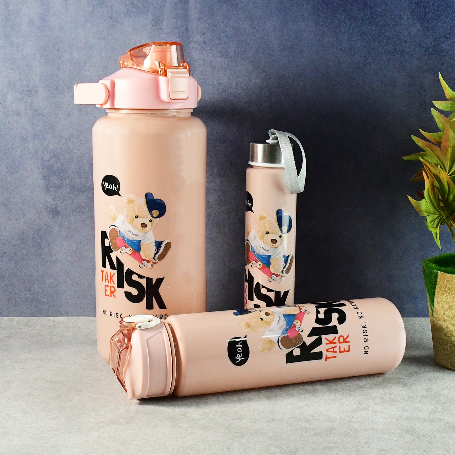Set of three Wukusy cartoon printed water bottles for kids, featuring colorful, playful designs in a home and kitchen setting.