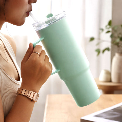 Wukusy Toony Tumbler 1800ml plastic travel sipper with handle, straw, and lid, shown with a colorful design and secure lid.