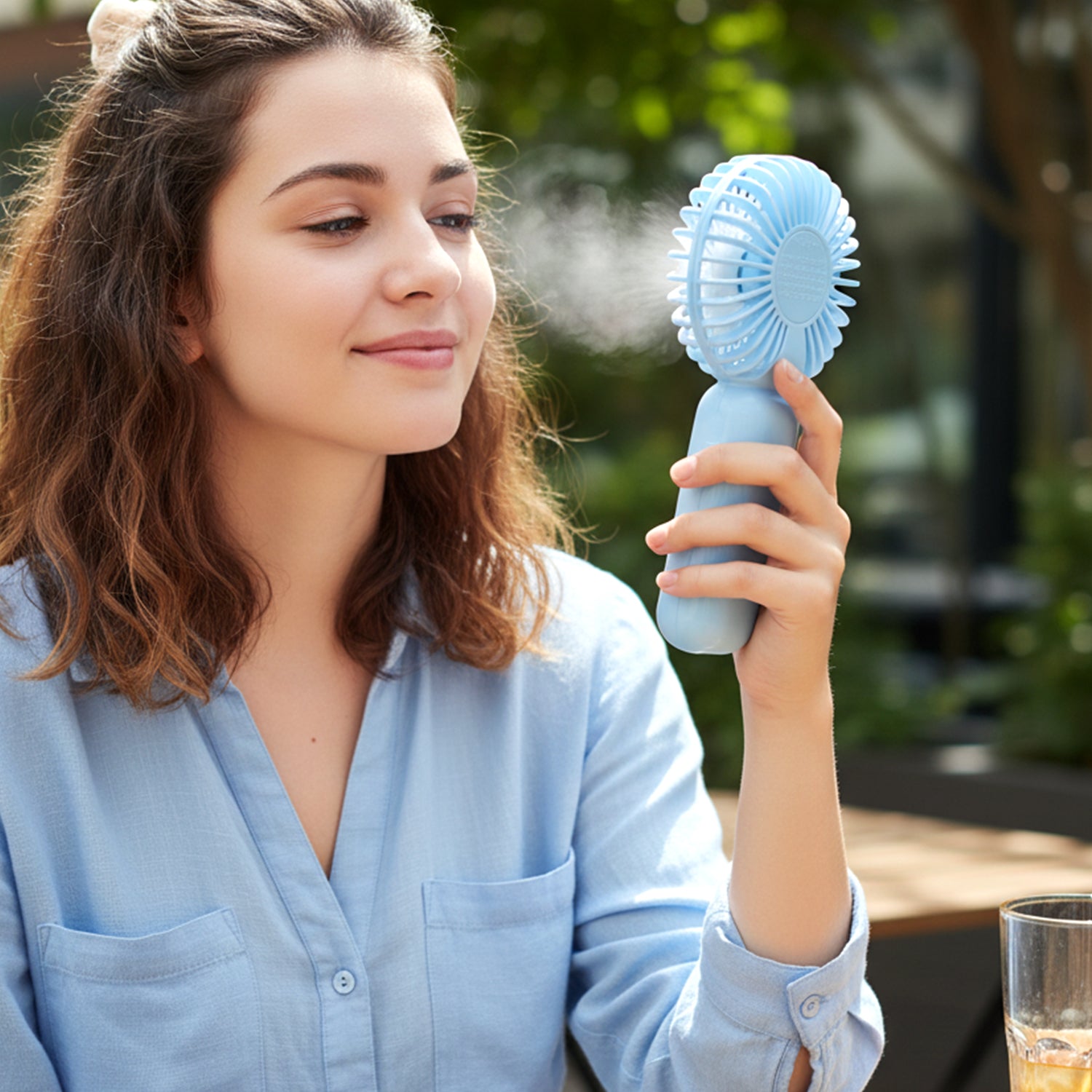 Wukusy portable mini handheld fan for personal cooling, compact design with adjustable blades, ideal for on-the-go use.