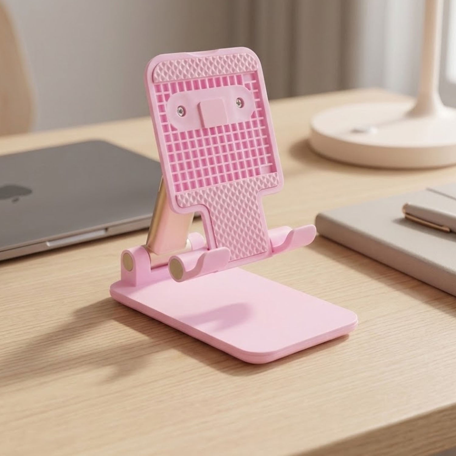 Wukusy adjustable folding desktop mobile phone stand holder showing a black phone held at an angle on a wooden surface