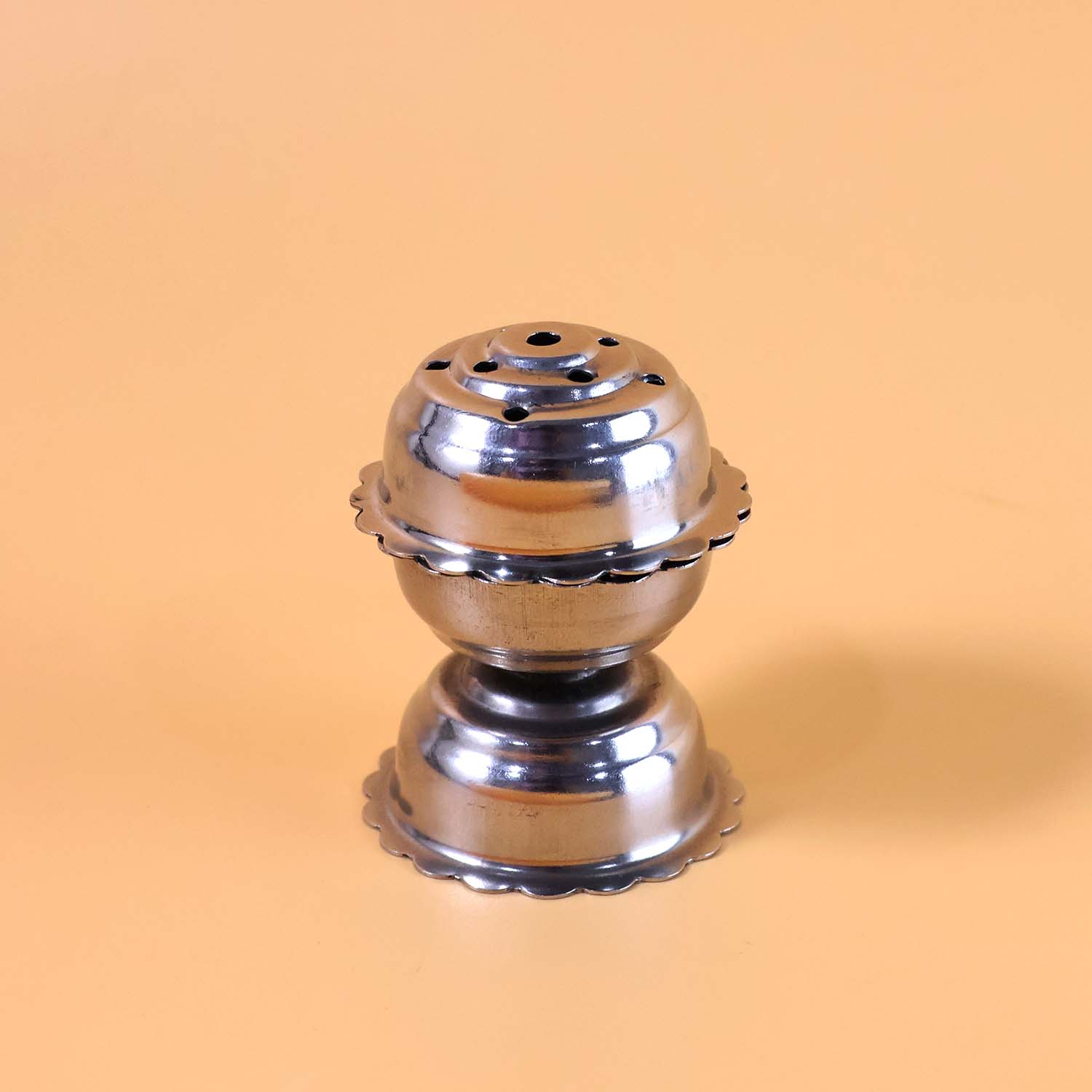 Stainless steel jasmine agarbatti stand by Wukusy with multiple slots for incense sticks on a reflective surface.
