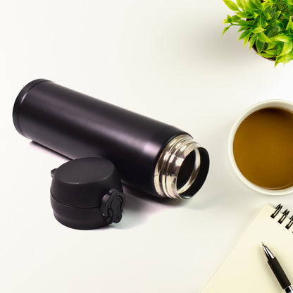 Wukusy insulated stainless steel water bottle for kids, 500ml, in vibrant mix of colors, with a child-friendly design.
