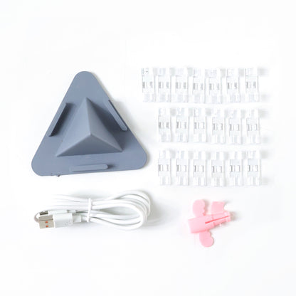 Wukusy mobile accessories combo set with charging cables, phone holder, and earphones arranged on a white background.