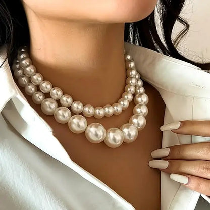 Two-layer artificial pearl mala with matching earrings, stylish imitation jewelry set featuring elegant design and intricate detailing.