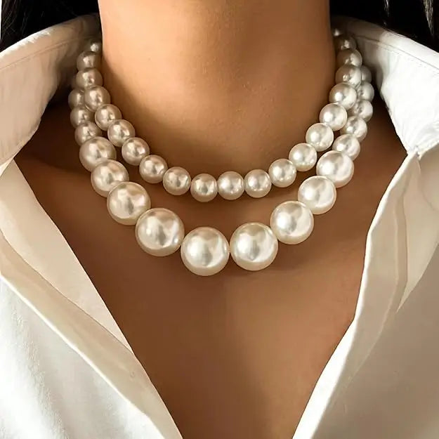 Two-layer artificial pearl mala with matching earrings in imitation jewelry set, stylish and elegant for traditional occasions.