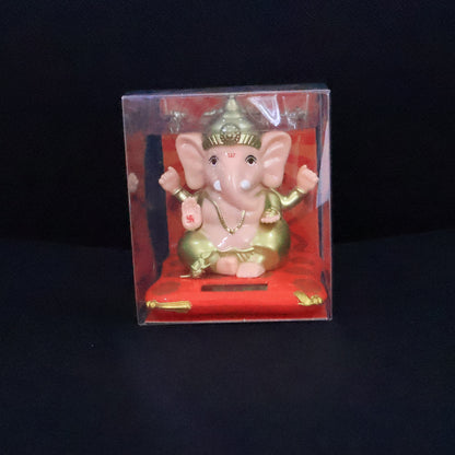 Decorative medium Lord Ganesh idol statue with solar-powered base, ideal for home decor, by Wukusy.
