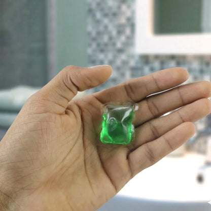 Wukusy concentrated liquid laundry detergent pods in a container, showing 25 colorful pods for stain removal and fabric cleaning.