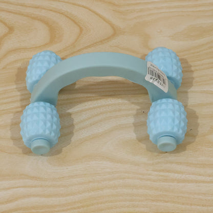 Wukusy handheld 4-roller body massager for muscle relaxation, shown being used on arms, legs, and back.