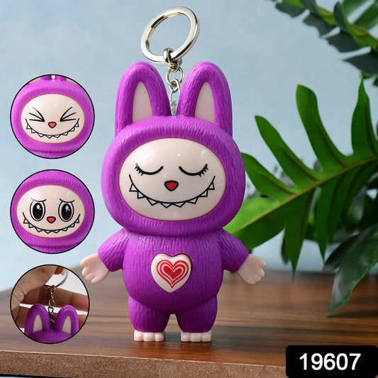 Wukusy cartoon character face-changing toy with key holder keychain, colorful and fun accessory for kids and collectors.