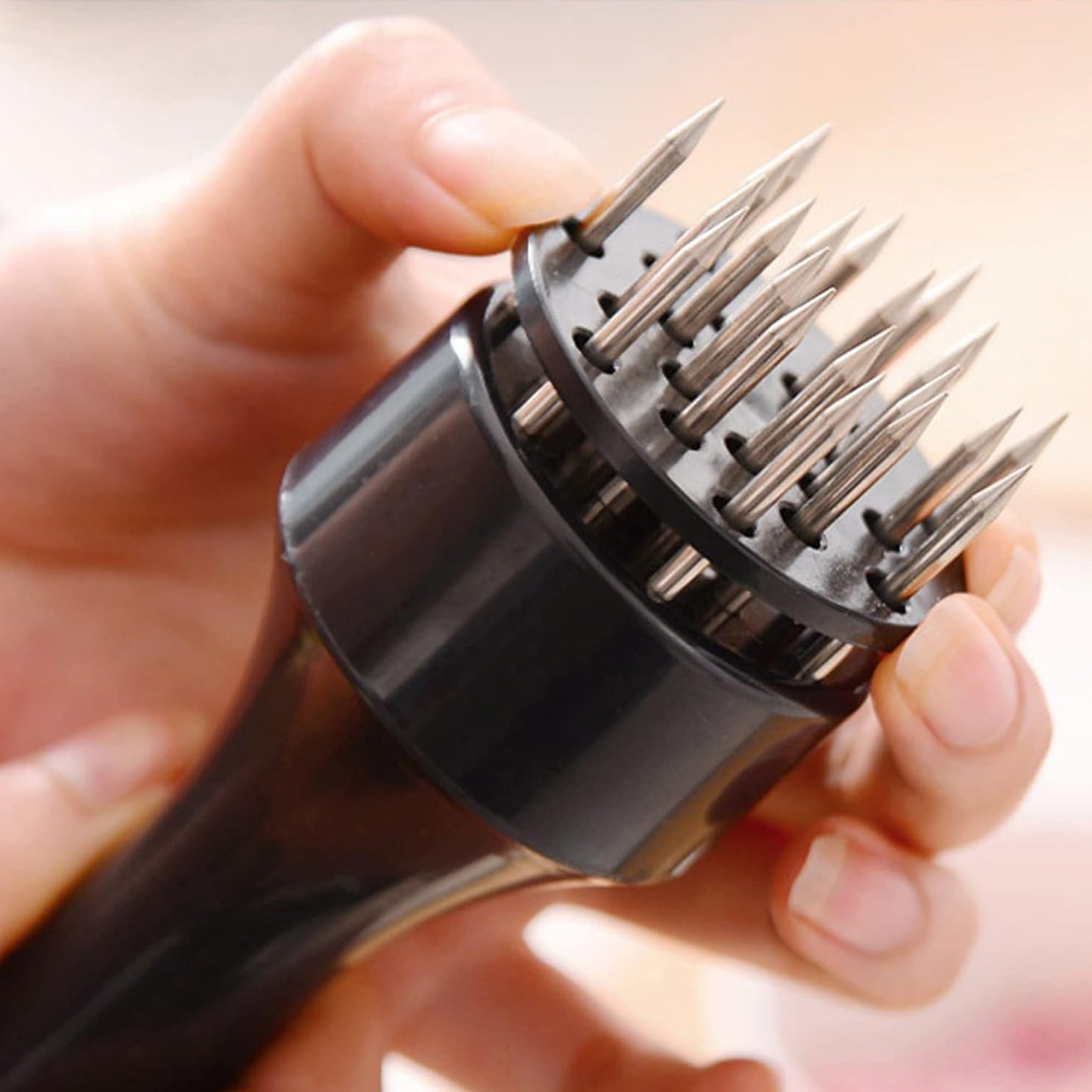 Stainless steel meat tenderizer tool with needle design by Wukusy, ideal for tenderizing cuts of meat in home and kitchen use.