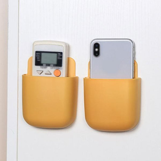 Multicolour Wukusy 1379 wall-mounted storage box for remote and mobile accessories, organized in a compact, wall-mounted case.