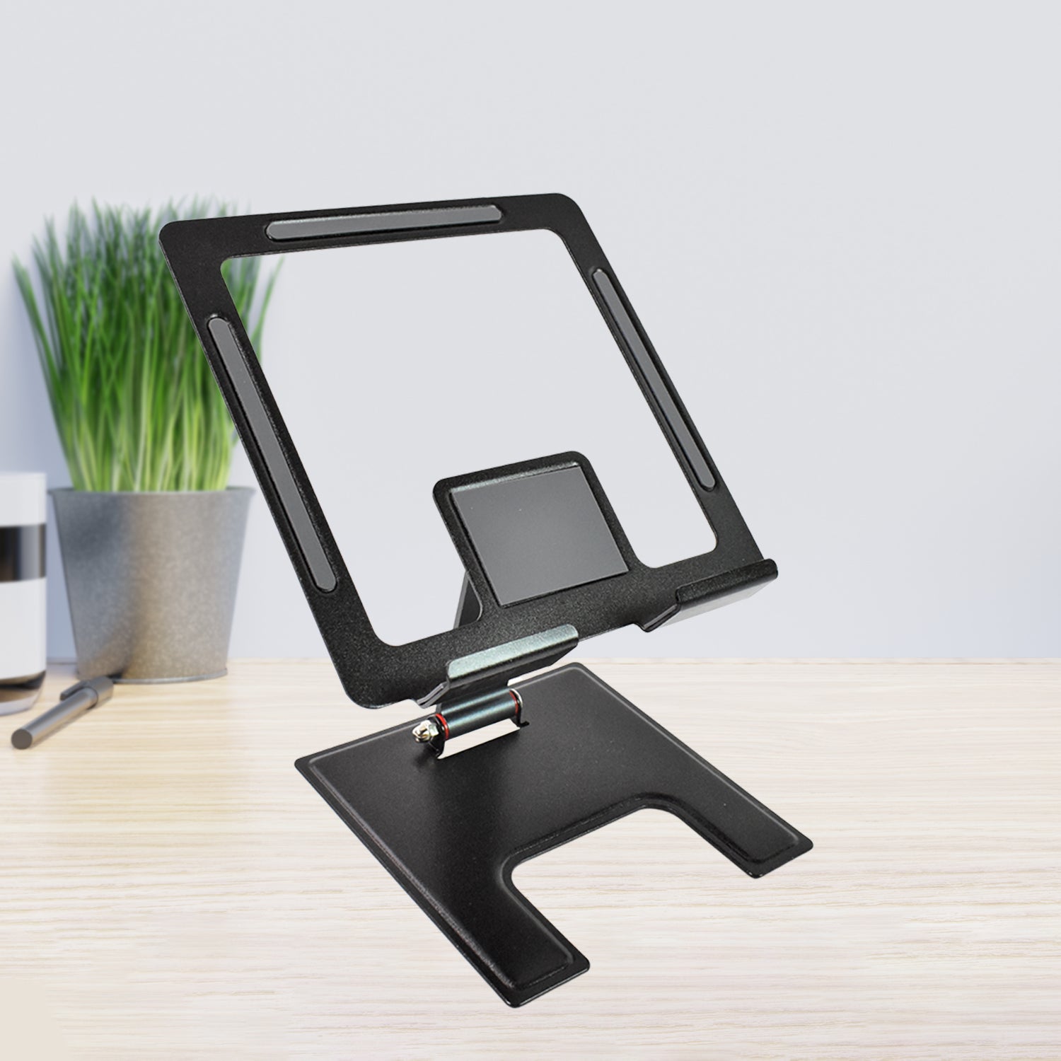 Wukusy adjustable aluminium alloy desktop stand holding a smartphone for hands-free viewing and easy access.