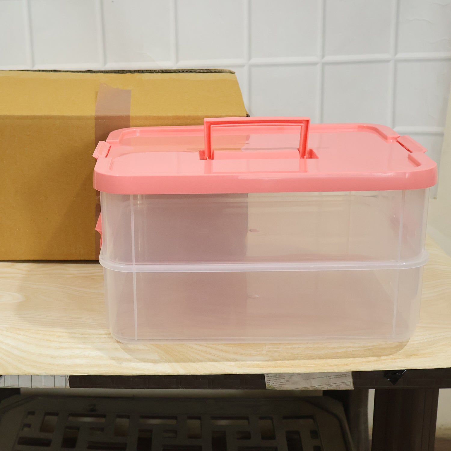 Transparent plastic storage box with lid, 2-layer stackable organizer by Wukusy, ideal for storing various household items.