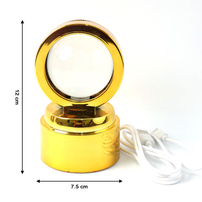 Wukusy Radhe Krishna crystal ball night light on office desk, decorative crystal lamp with intricate Krishna design.