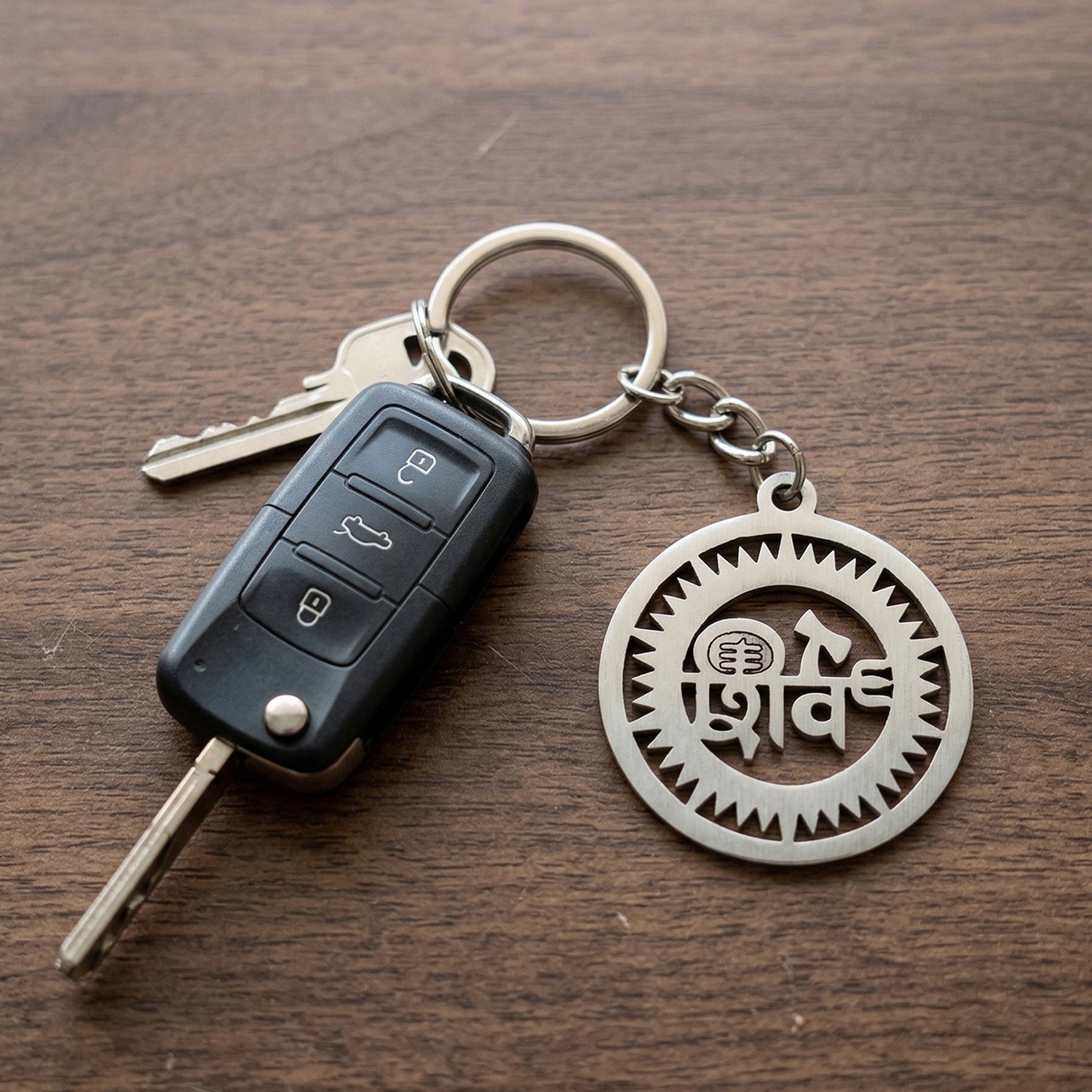 Wukusy premium metal round Shiv keychain with intricate design, featuring a polished surface and a keyring attachment.