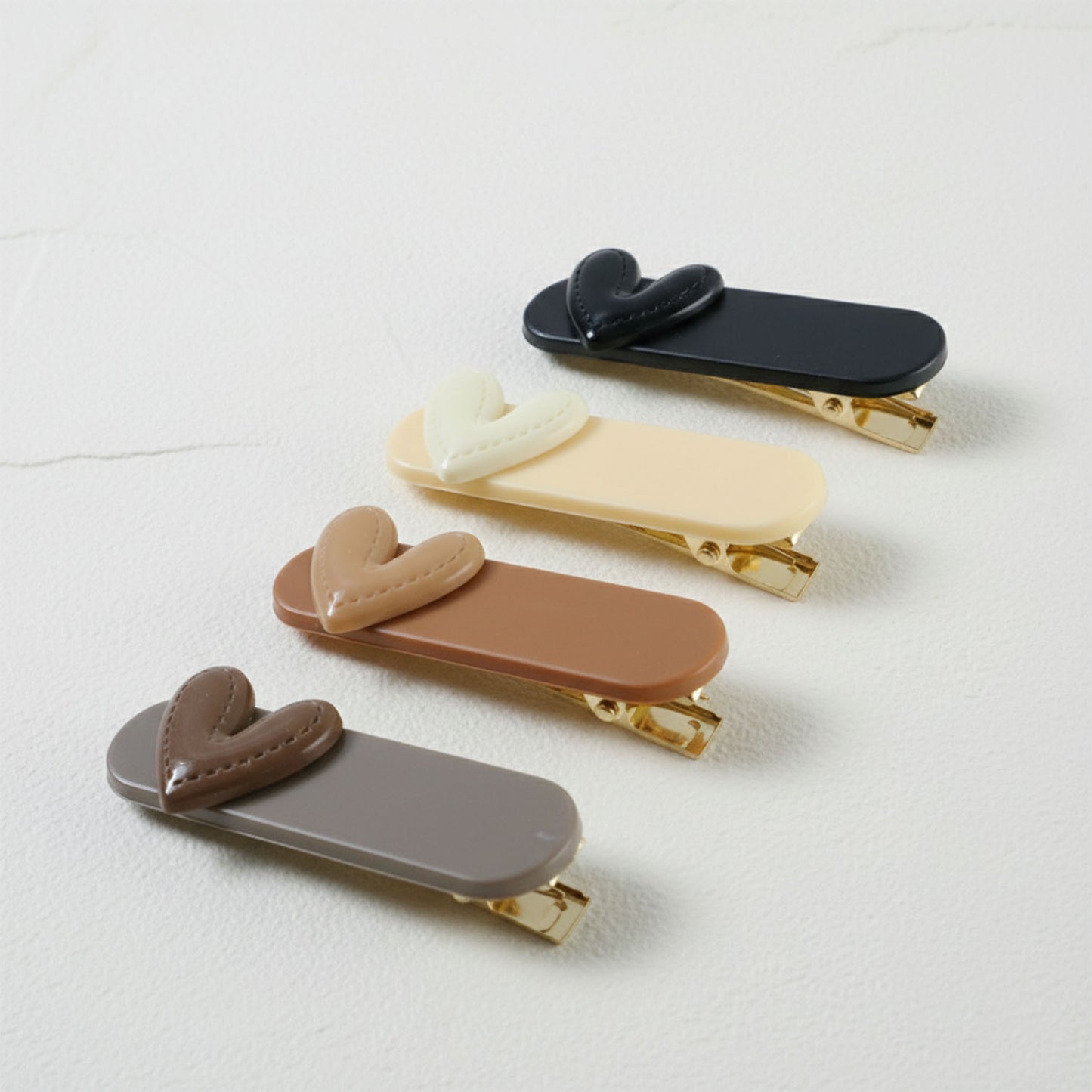 Set of four Wukusy decorative hair clips featuring colorful, stylish designs for easy hair accessory styling.