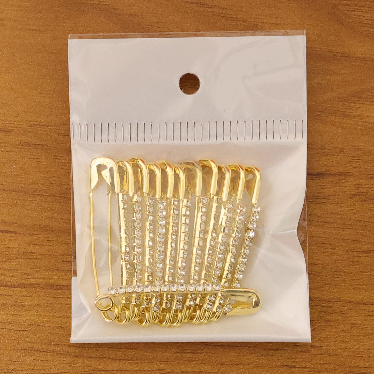 Set of 12 decorative golden safety pin brooches by Wukusy, featuring stylish and versatile accessory designs for fashion and embellishment.