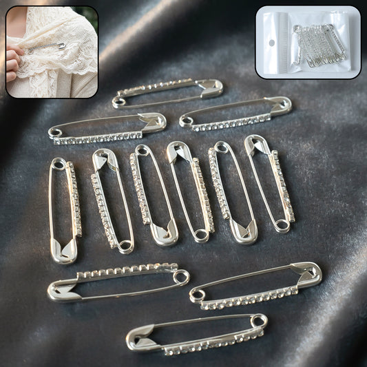 Set of 12 decorative silver finish safety pin brooches featuring intricate designs, ideal for accessories or craft projects.