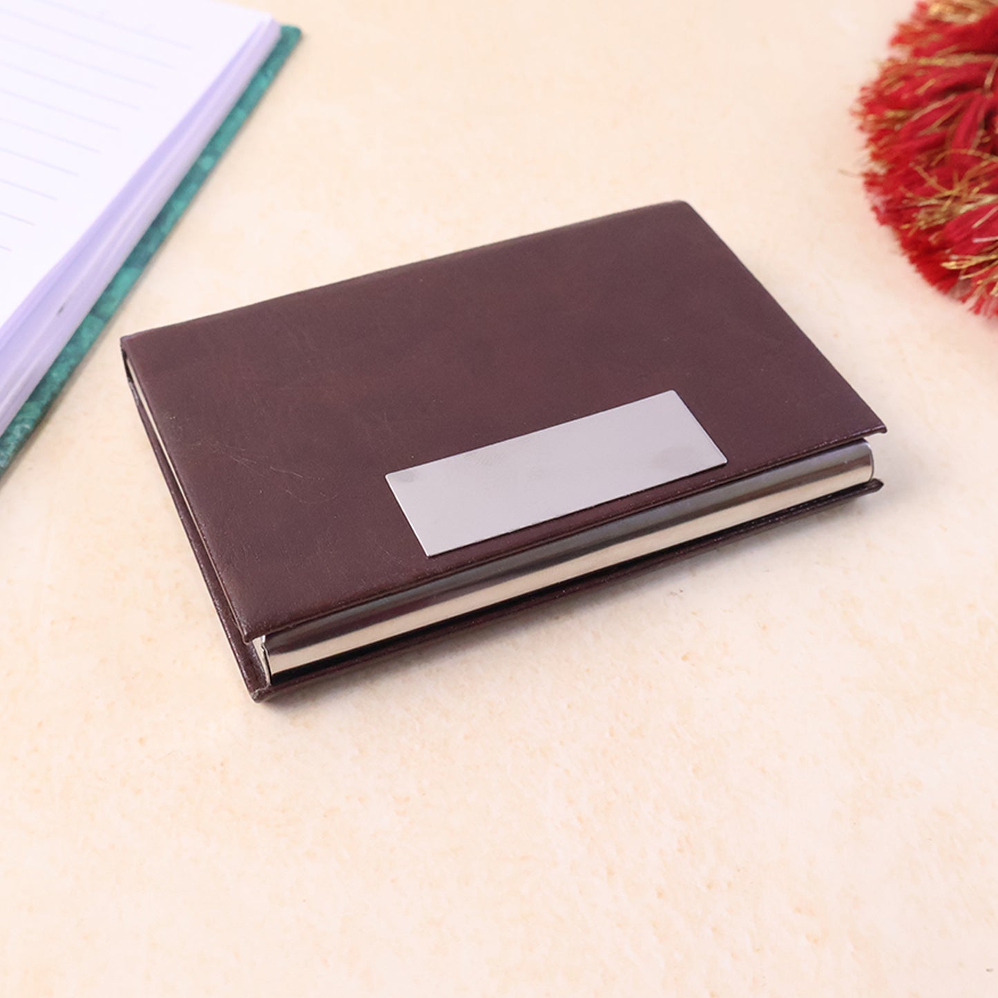 Wukusy premium executive travel business card holder with sleek black leather exterior and secure snap closure, designed for professionals.