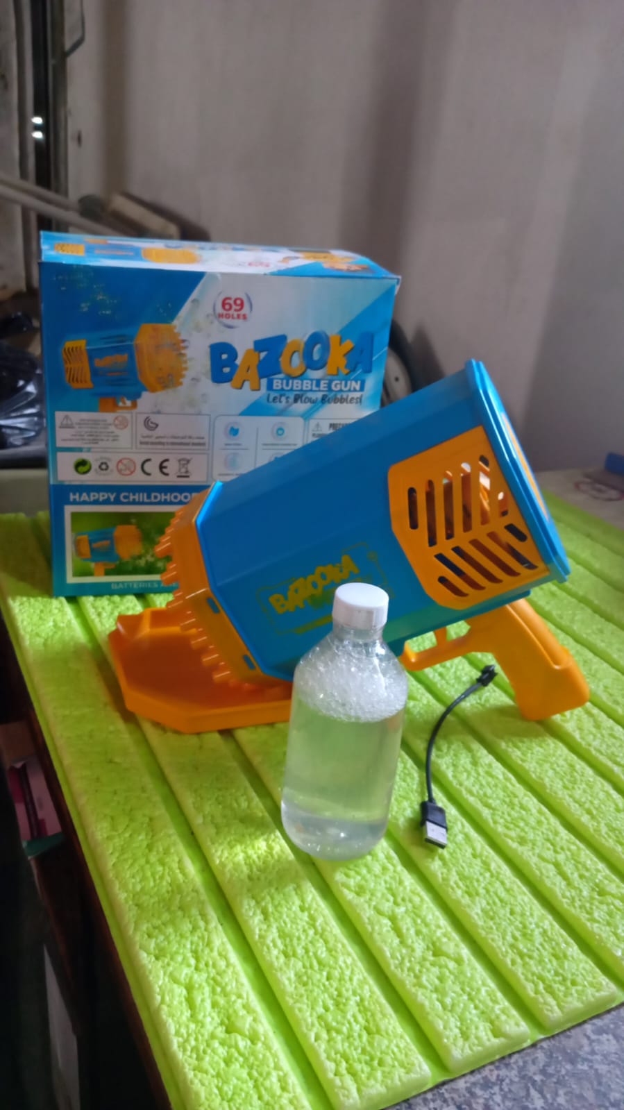 Wukusy 69 Holes rechargeable bubble gun toy for kids and adults, featuring a big rocket design and powerful bubble-blowing capabilities.