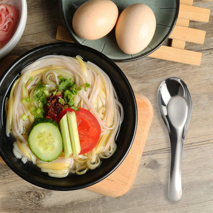 Six Wukusy Apex Premium stainless steel soup spoons arranged together, showcasing durable, polished kitchen utensil set.